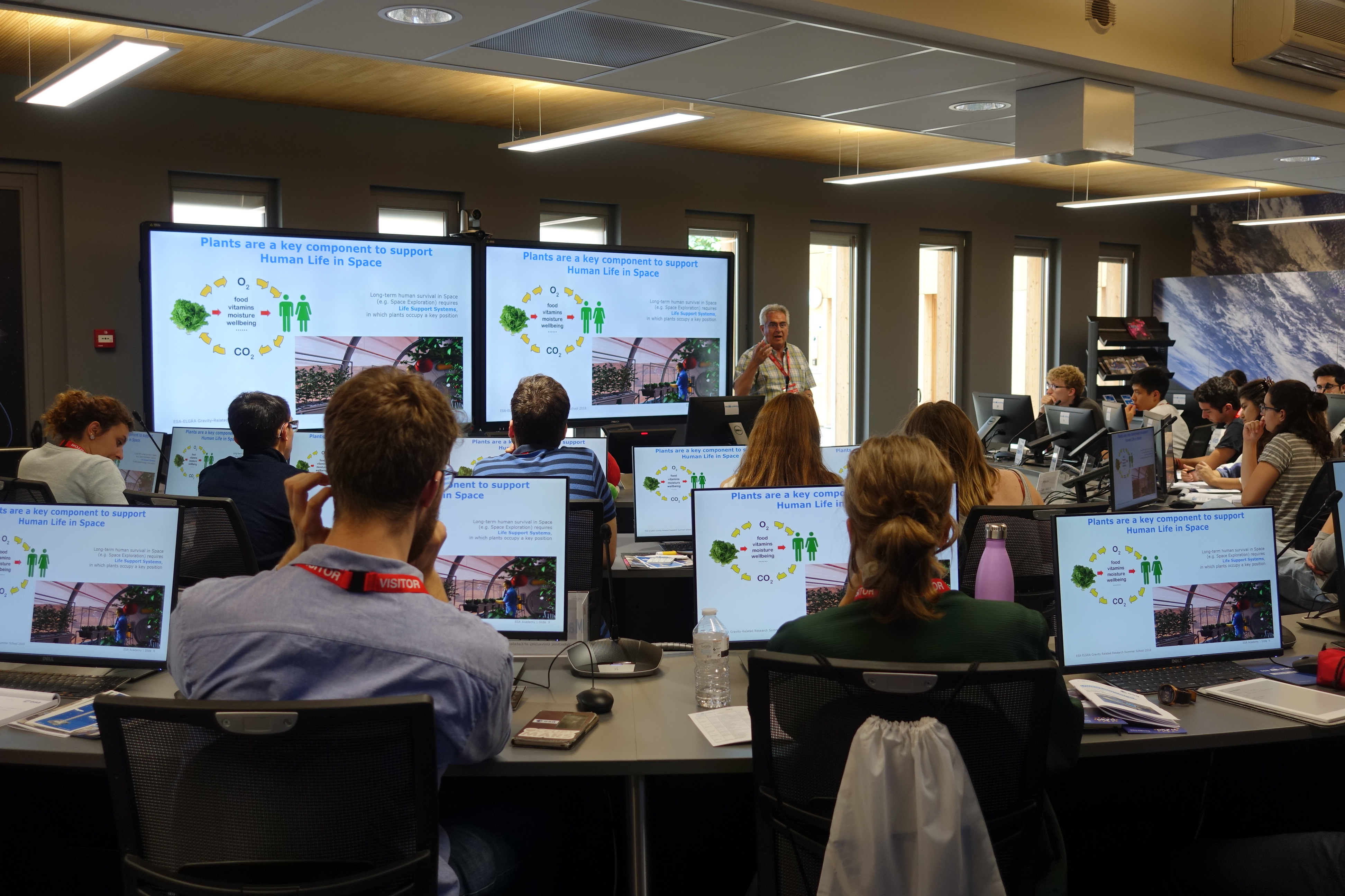 Students attending lecture about the growth of plants in space