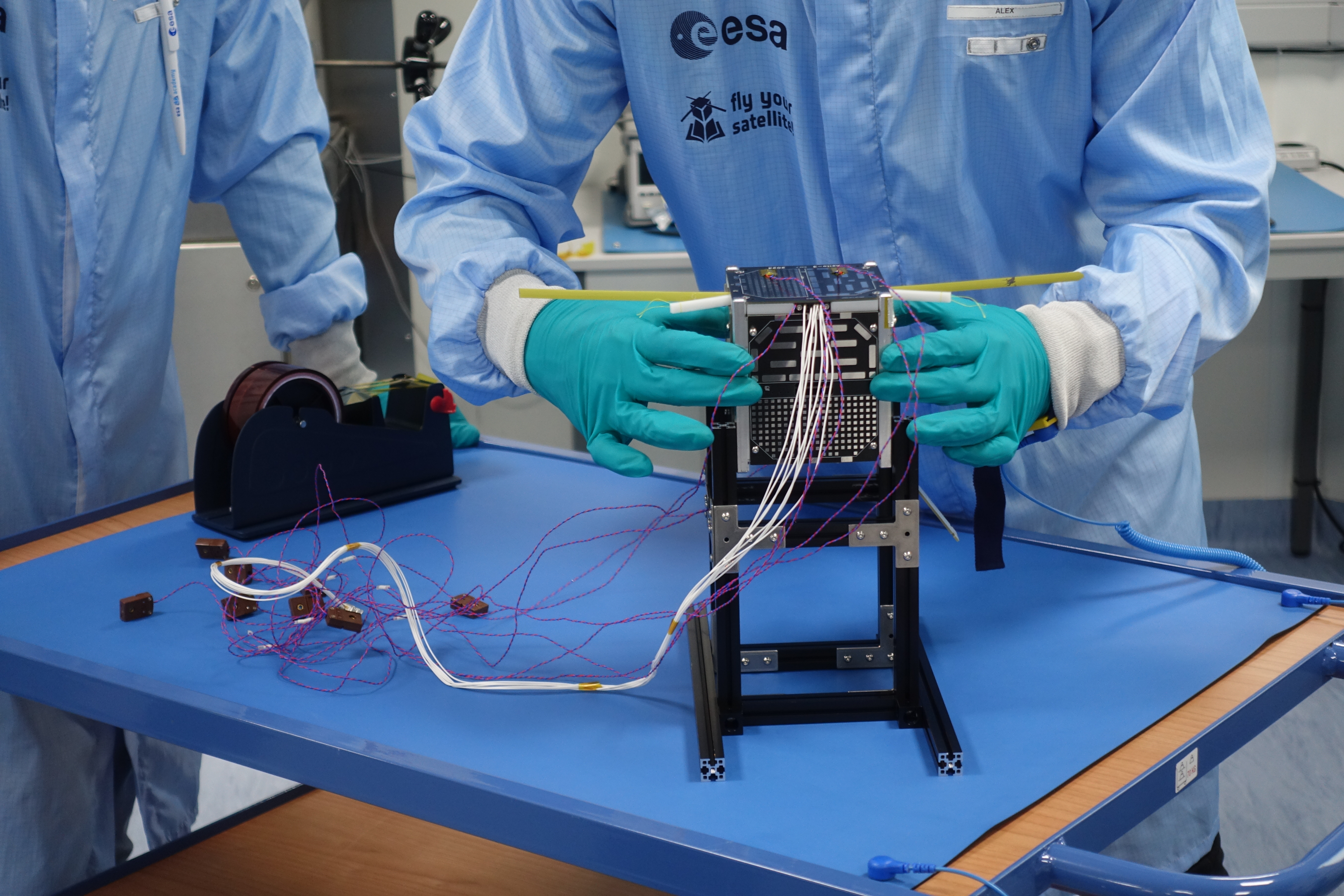 The satellite carefully placed on the support after the thermal vacuum test