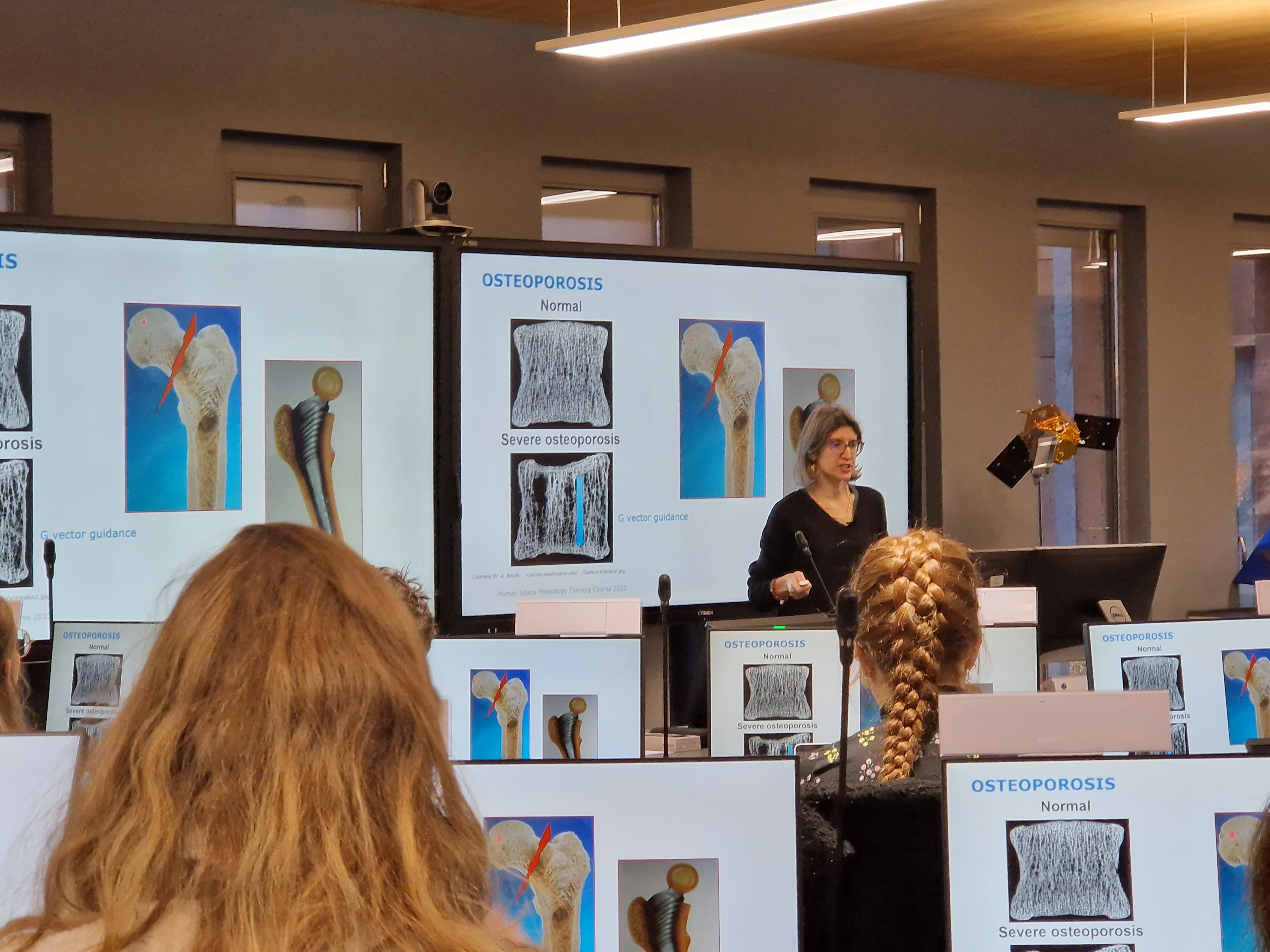 Expert lecturing on the impact of microgravity on bone density